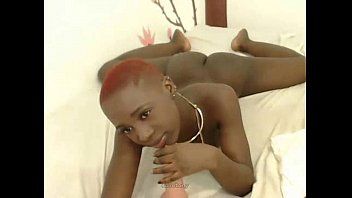 Shaved african lalin girl engulfing large sex toy